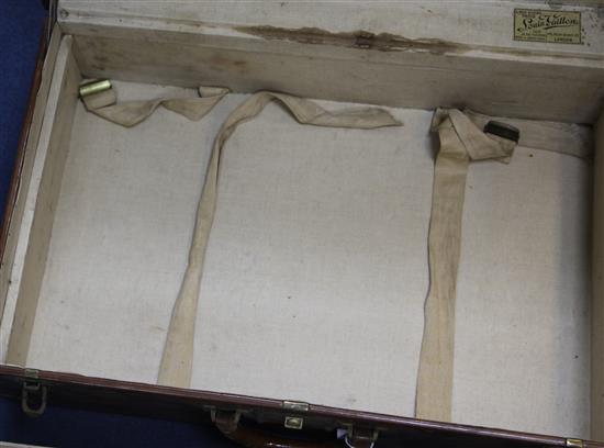 A Louis Vuitton leather suitcase, 26 x 16.5 x 8.5in.